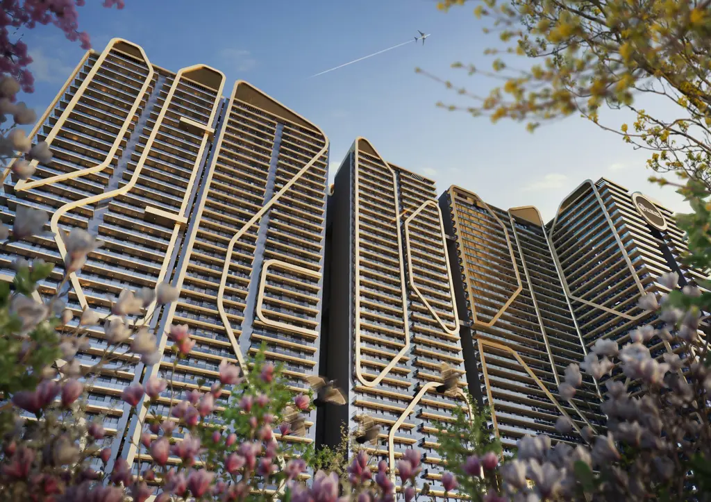 Sculptural façade of Opus One with gold architectural detailing